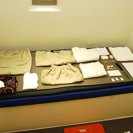 Photograph: Camp 5 cell, and a captive's issued items