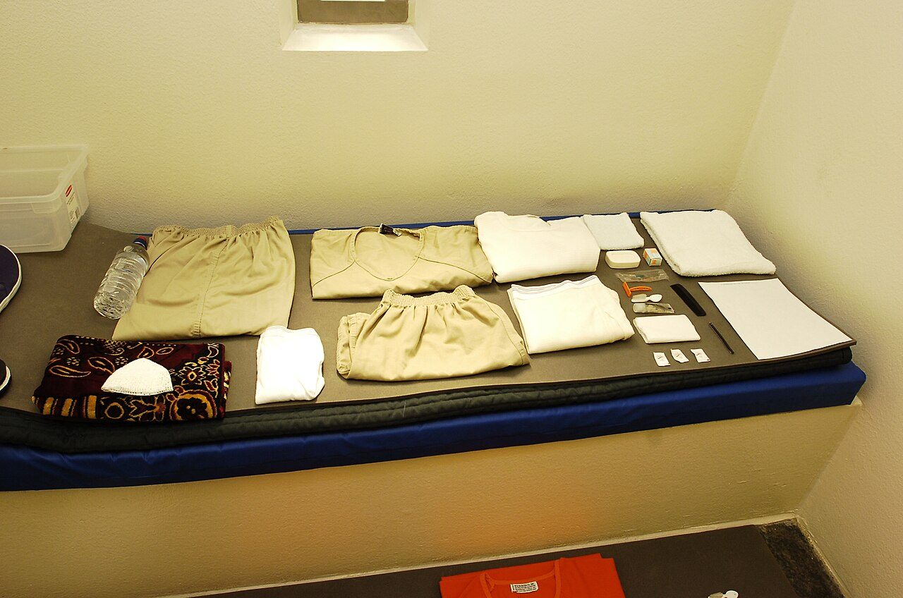 Photograph: Camp 5 cell, and a captive's issued items